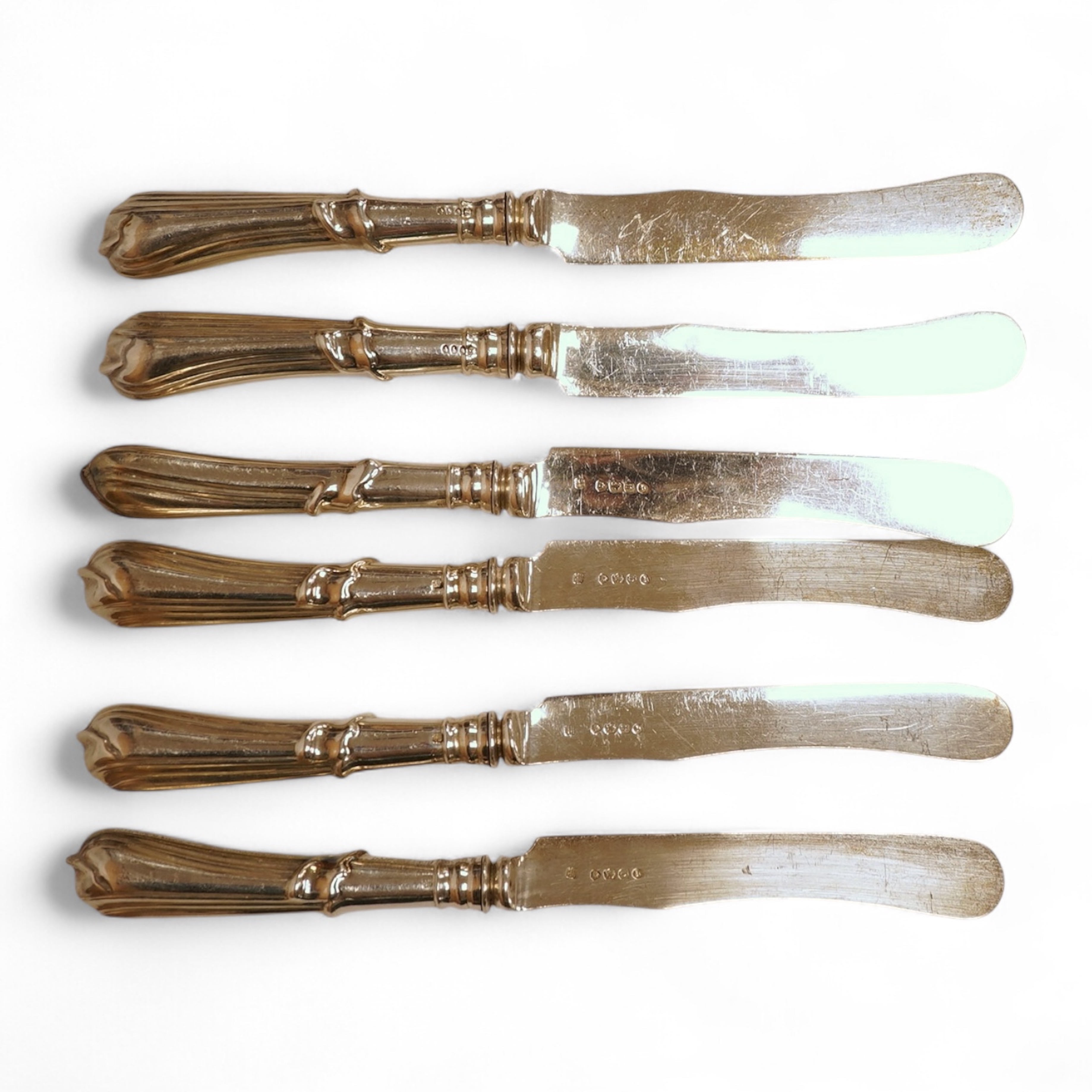 A set of six Victorian silver bladed dessert knives with loaded silver handles, by Lias & Lias, London, 1871, 21cm.
